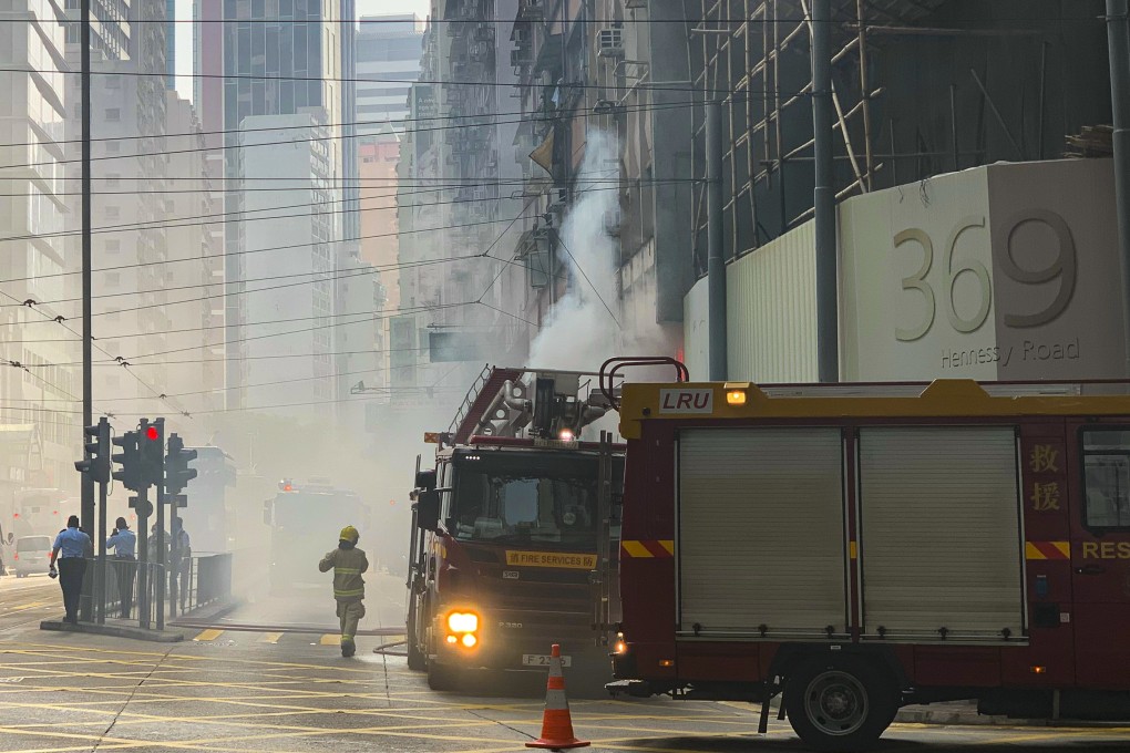 Emergency services respond to the fire on Hennessy Road in Wan Chai. Photo: Warton Li