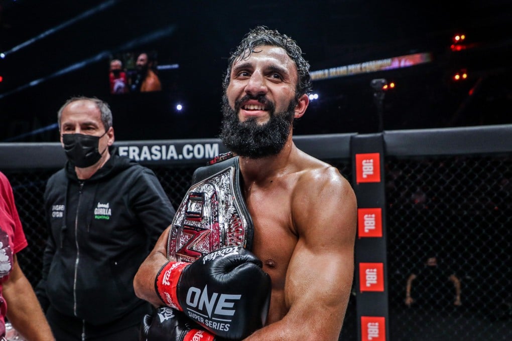 Chingiz Allazov celebrates after beating Sitthichai to win the featherweight kickboxing grand prix final at ONE X.