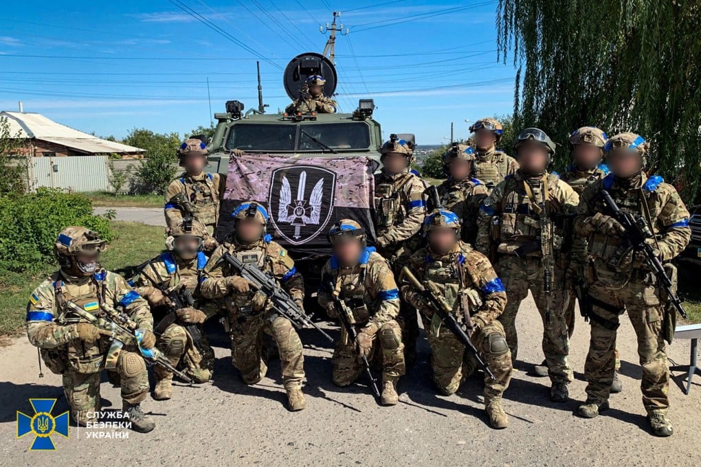 Members of the State Security Service of Ukraine pose for a picture in the recently liberated town of Kupiansk in the Kharkiv region. Photo: Reuters