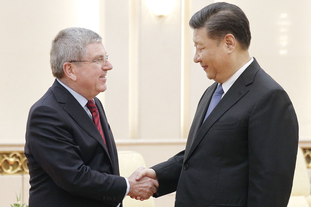 International Olympic Committee president Thomas Bach (left) and Chinese President Xi Jinping shake hands before their talks at the Great Hall of the People, ahead of the 2022 Beijing Winter Games. Photo: Kyodo