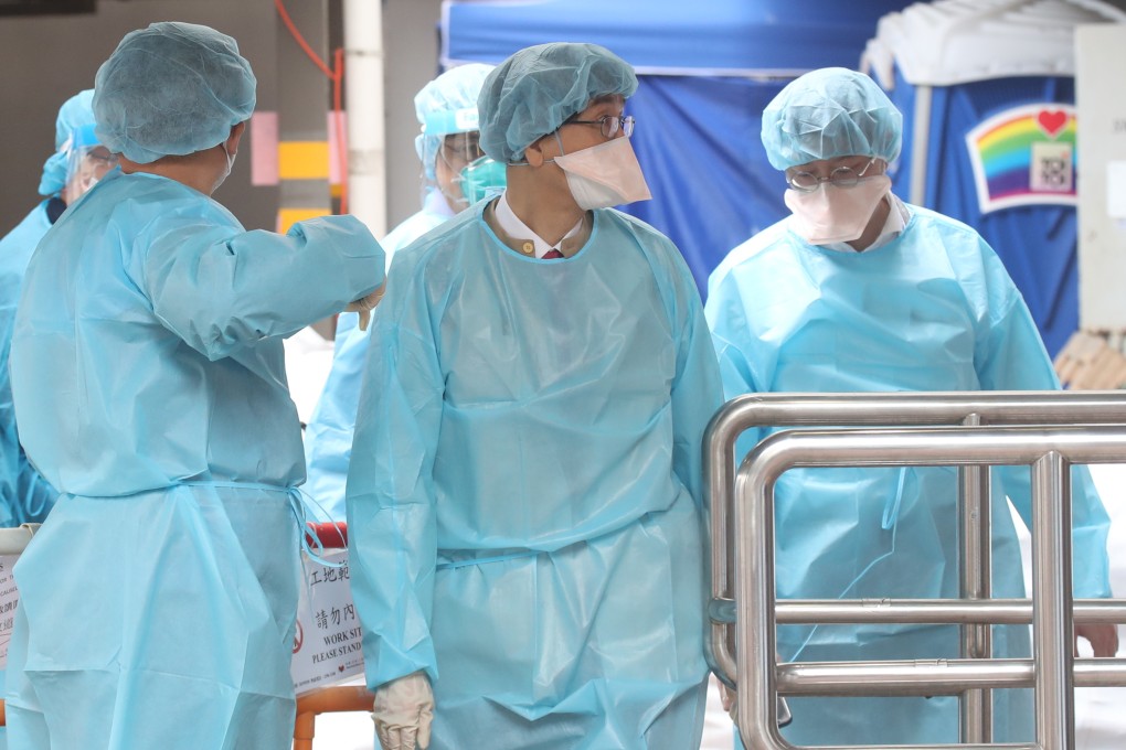 Microbiologist Professor Yuen Kwok-yung (centre) visits Choi Wan Estate during a lockdown earlier this year. Photo: Edmond So