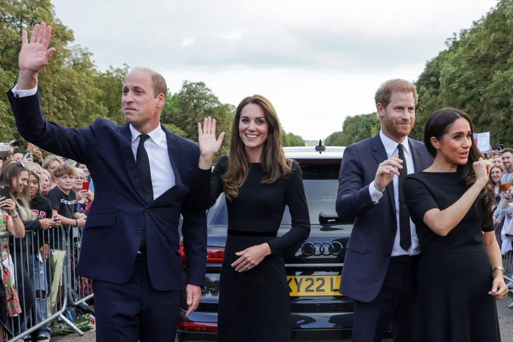 (L-R) Britain’s Prince William, Prince of Wales, Britain’s Catherine, Princess of Wales, Britain’s Prince Harry, Duke of Sussex, Britain’s Meghan, Duchess of Sussex, wave at well-wishers on the Long walk at Windsor Castle on Saturday. Photo: Pool via AFP