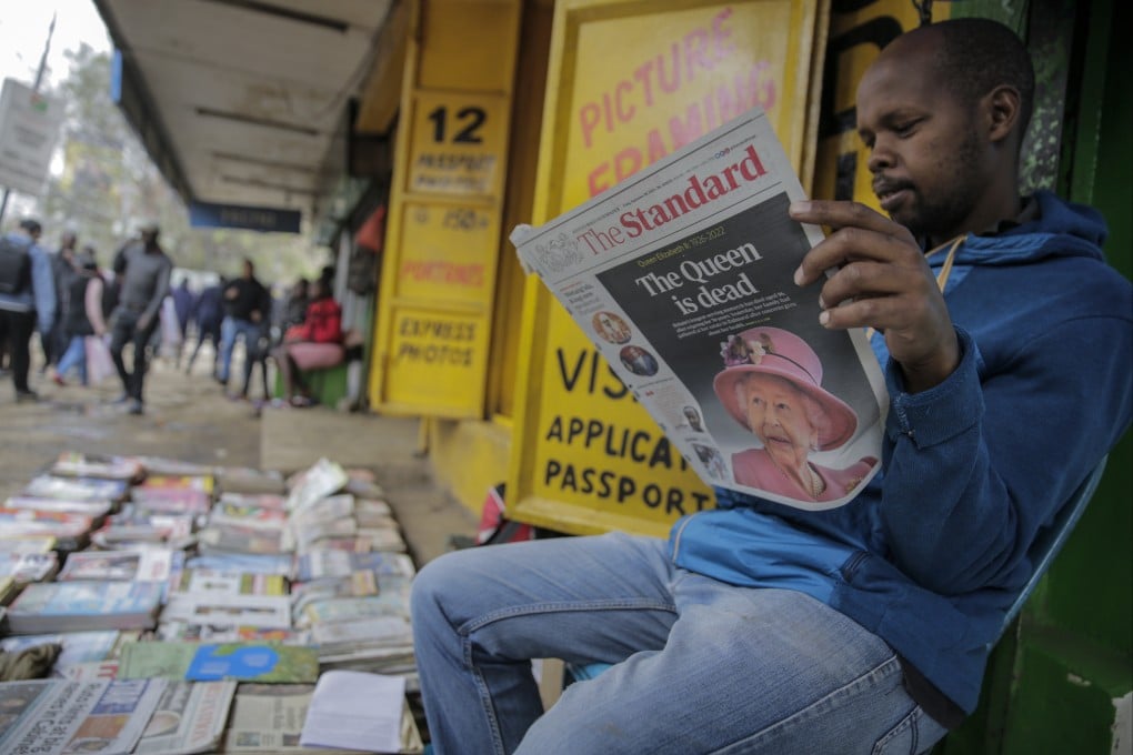 A vendor reads a newspaper showing coverage of the death of Queen Elizabeth, in downtown Nairobi, Kenya on Friday. Photo: AP