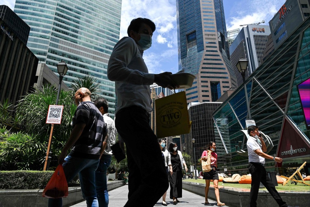 Office workers walk during lunch time at Raffles Place in Singapore’s financial business district on August 22, 2022. The city has seen only three SPAC listings since allowing the mechanism in late 2021. Photo: AFP