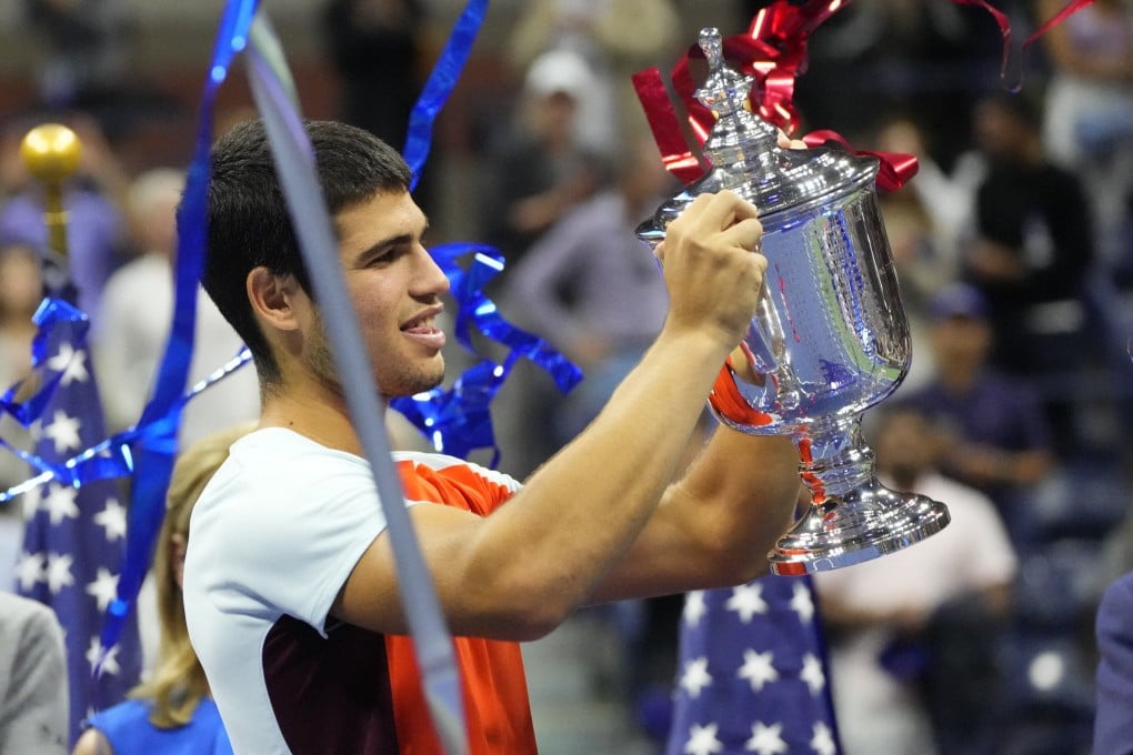 Carlos Alcaraz celebrates with the championship trophy. Photo: USA TODAY Sports