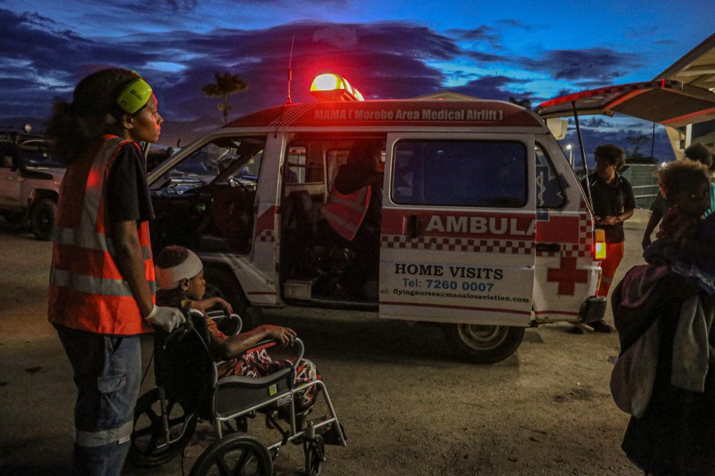 Injured villagers arrive at a hospital after being evacuated via helicopter in Papua New Guinea  on Sunday. Photo: AFP