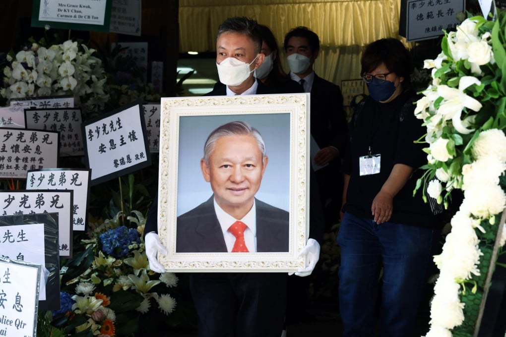Glen Lee holds a portrait of his father Ambrose Lee at the funeral in Hung Hom. Photo: Dickson Lee