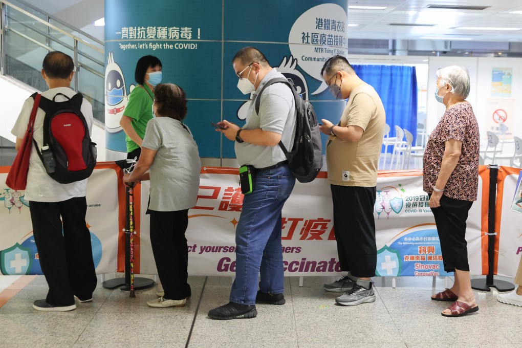 Residents line up to receive a coronavirus jab. Photo: Edmond So