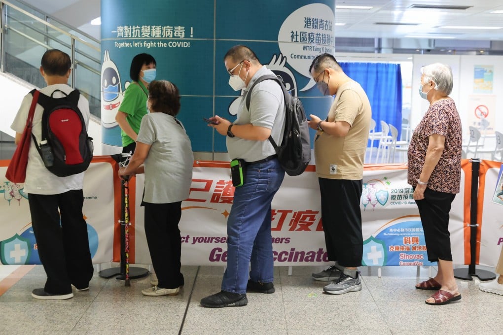 Residents line up to receive a coronavirus jab. Photo: Edmond So