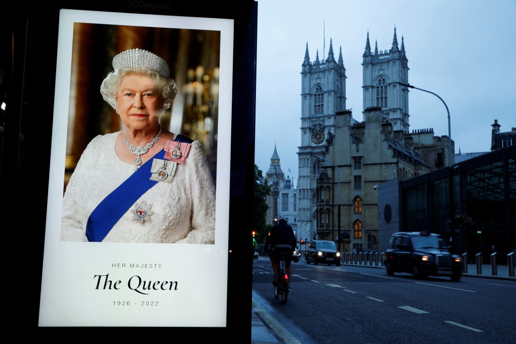 A portrait of Queen Elizabeth is displayed at a bus stop outside Westminster Abbey, where the funeral will be held. Photo: Reuters