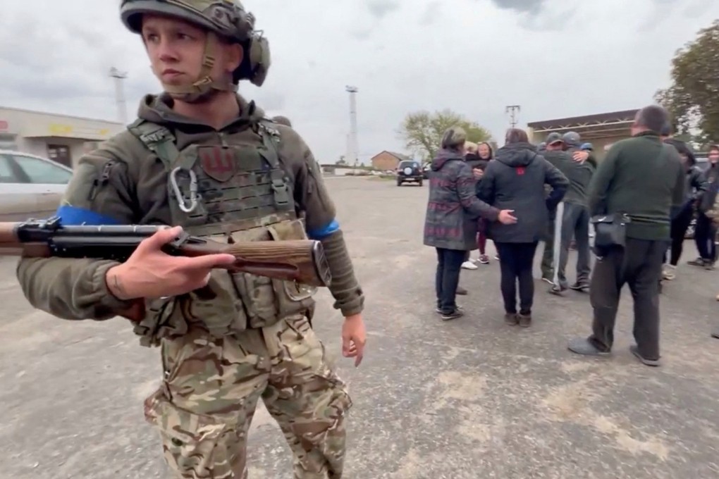 Residents greet soldiers in a location given as Kozacha Lopan, Kharkiv Region, Ukraine on Sunday. Photo: Facebook/Vyacheslav Zadorenko/via Reuters