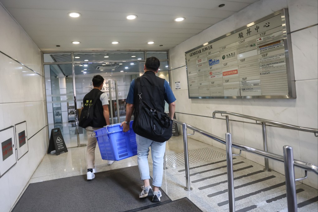 Police enter Engineering Impact’s office in Hung Hom to gather evidence. Photo: Jonathan Wong