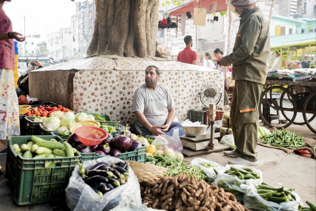 A vendor at a vegetable stall in New Delhi. India posted 13.5-per-cent first-quarter growth between April and June. Photo: Bloomberg