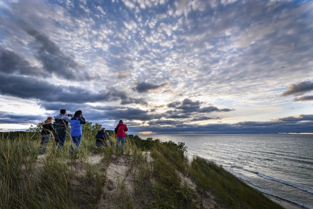 A view from Mount Baldy, in Indiana Dunes National Park, at sunset. With more than 140 km of hiking, cycling and horse riding trails; historical sites, beaches, and breathtaking biodiversity, the area is a popular natural haven. Photo: Indiana Dunes National Park Ranger Rafi Wilkinson