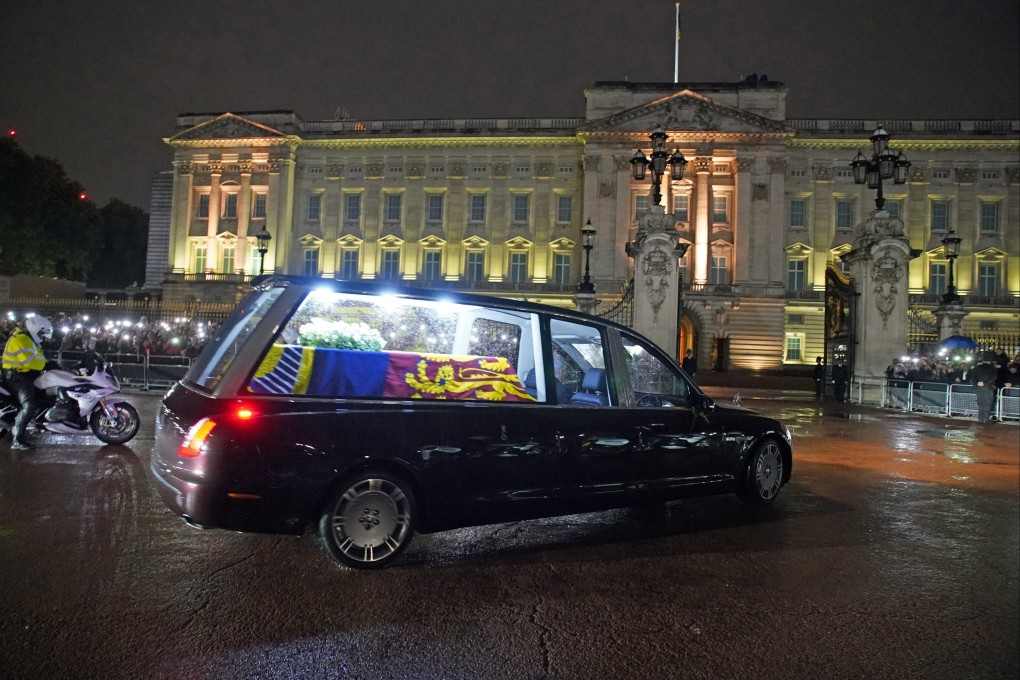 The hearse carrying the coffin of Queen Elizabeth II arrives at Buckingham Palace in London on Tuesday. Photo: Reuters