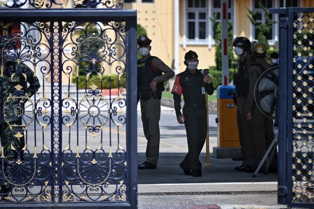 Thai policemen and army personnel patrol inside the gates of the Royal Thai Army War College after Wednesday’s shooting. Photo: AFP