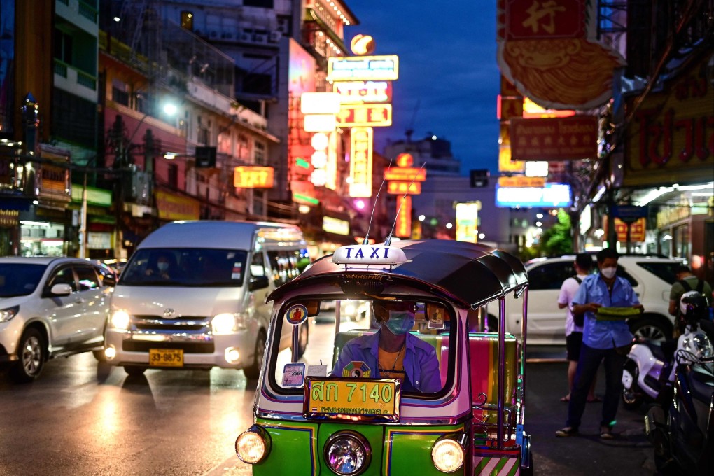 A tuk-tuk driver waits for customers on Yaowarat Road in the Chinatown area of Bangkok earlier this month. ‘We have a friendly environment and are open to work with foreigners,’ an official said. Photo: AFP