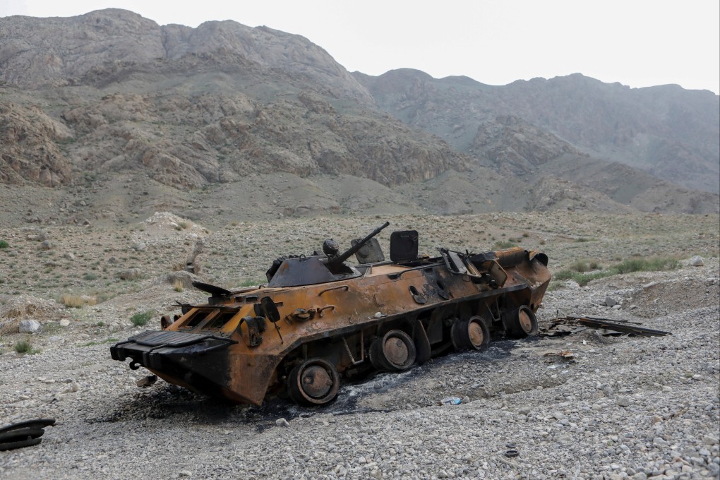 A burnt out vehicle along the border between Tajikistan and Kyrgyzstan in May 2021. Photo: Reuters