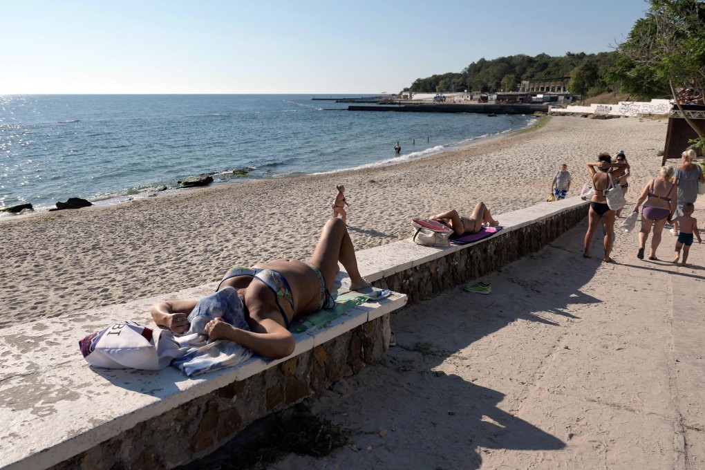 People visit a beach in Odesa, southern Ukraine, a city in which air-raid sirens sound routinely, but to which residents pay little attention. Photo: Future Publishing via Getty Images
