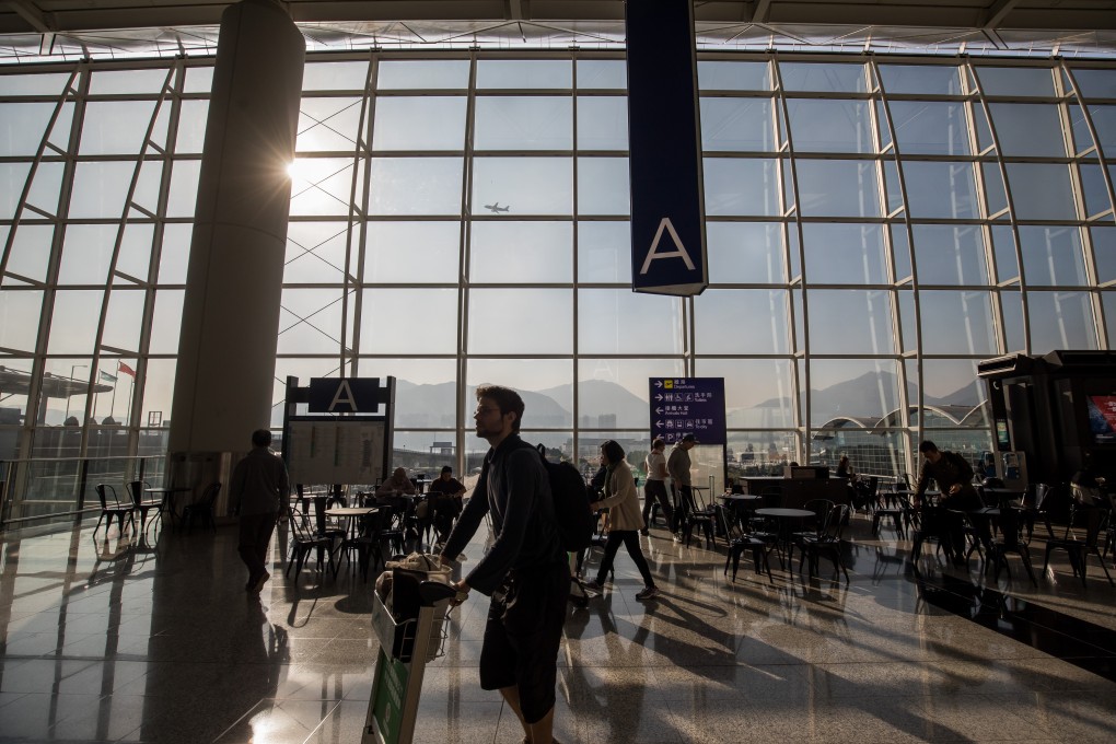 Travellers walking through the departure hall of the Hong Kong International Airport in 2019, in the era before coronavirus. Photo: Bloomberg