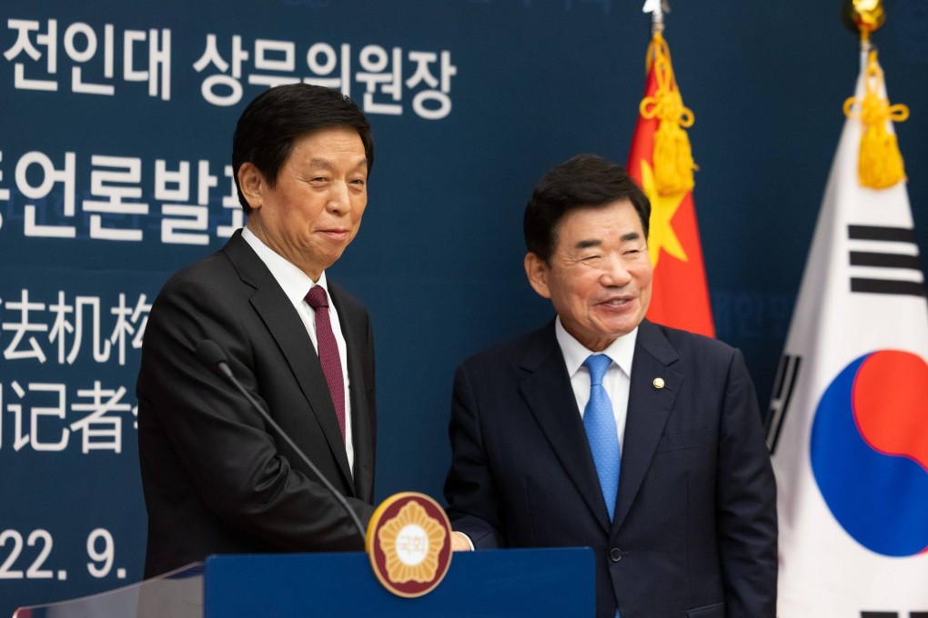 Li Zhanshu, chairman of the Standing Committee of the National Peoples Congress of China, left, shakes hands with South Korea National Assembly Speaker Kim Jin-pyo. Photo: Bloomberg