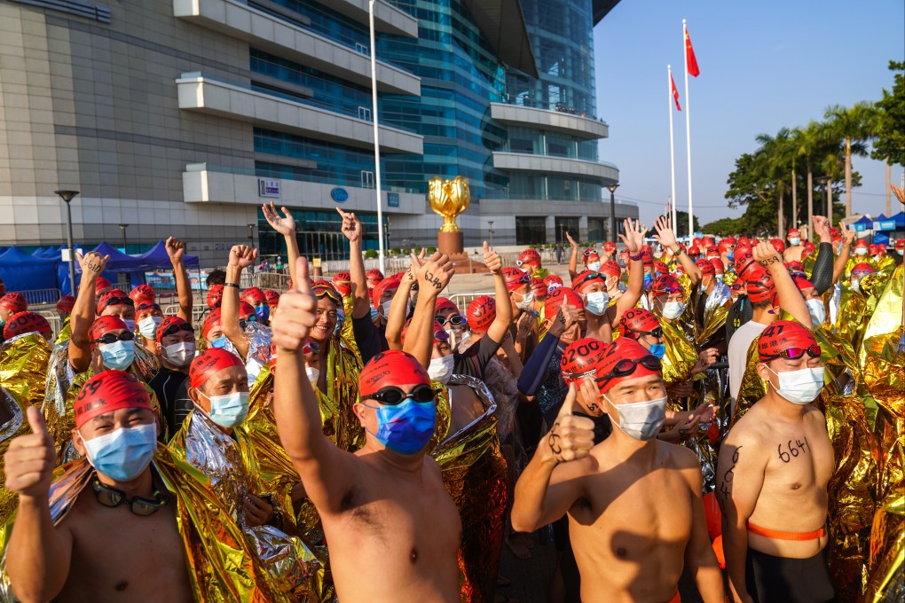 Swimmers wait for the start of the Cross Harbour Race in December, 2021. Photo: Sam Tsang