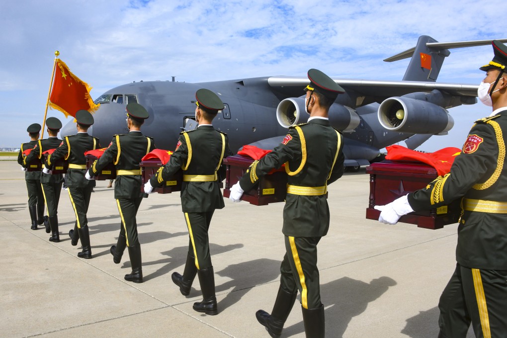 Chinese soldiers carry caskets containing the remains of soldiers killed in the Korean war. Photo: EPA-EFE