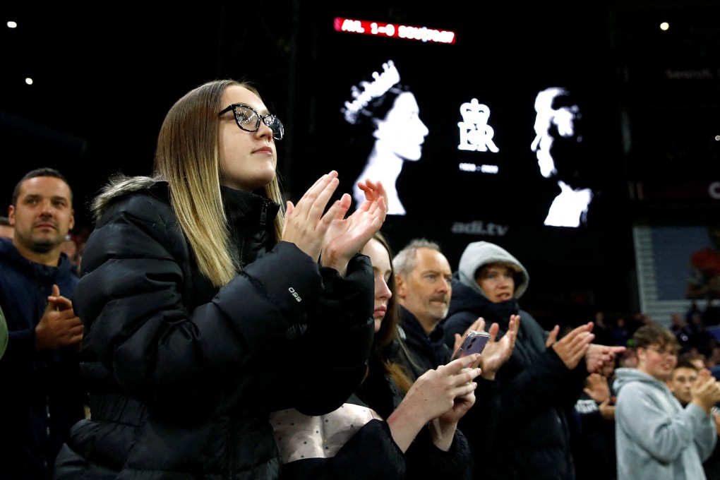 Fans applaud on seventy minutes during Aston Villa’s 1-0 win over Southampton following the death of Britain’s Queen Elizabeth. Photo: Reuters