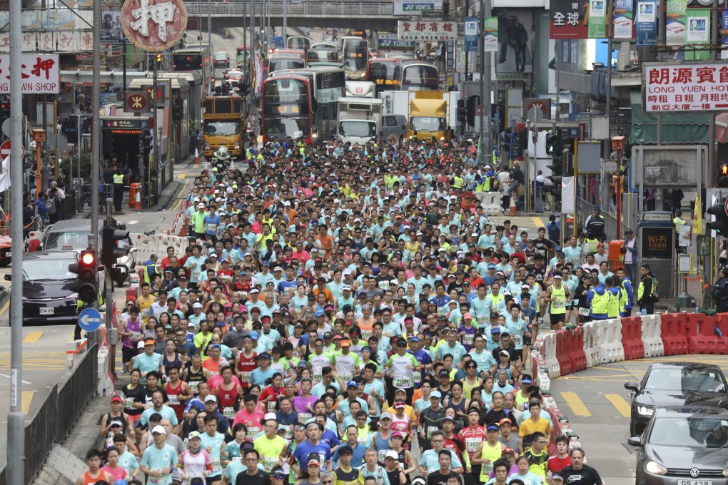 Runners hit the streets on Nathan Road during the 2019 Standard Charted Hong Kong Marathon. Photo: Dickson Lee.