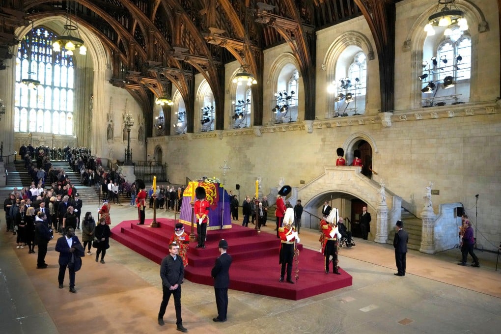 Members of the public file past the coffin of Queen Elizabeth lying in state in Westminster Hall ahead of her funeral on Monday. Photo: Reuters