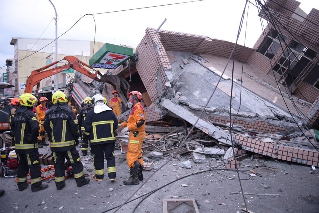 Emergency workers attend the scene of a collapsed building in Yuli township, Hualien county, after an earthquake on Sunday. Photo: AP
