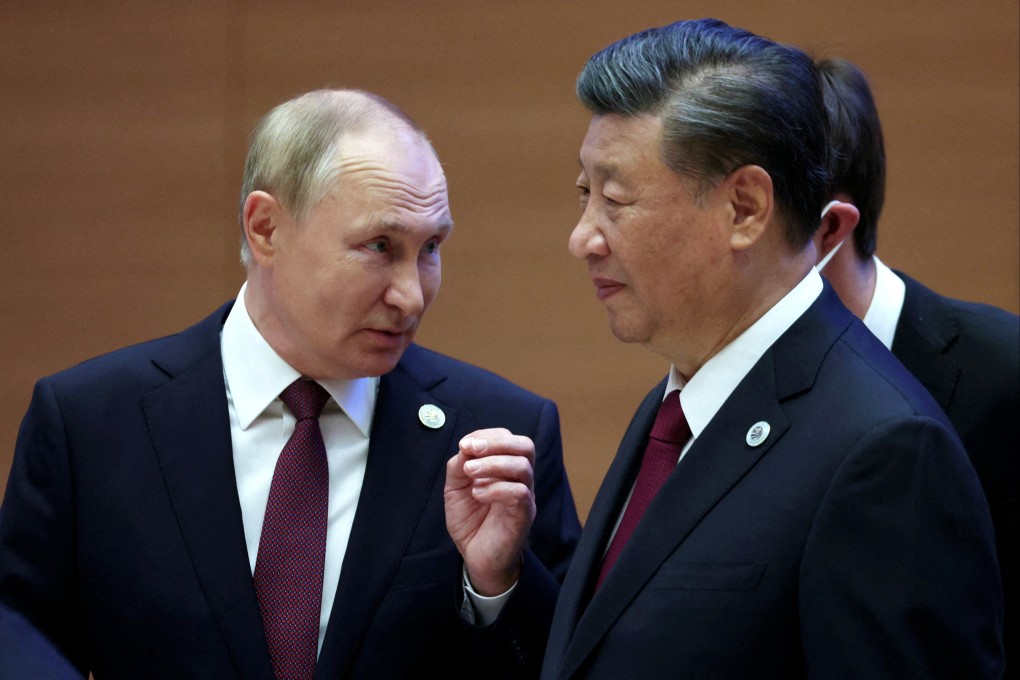 Russian President Vladimir Putin speaks to Chinese President Xi Jinping in Samarkand, Uzbekistan. Photo: Handout via Reuters