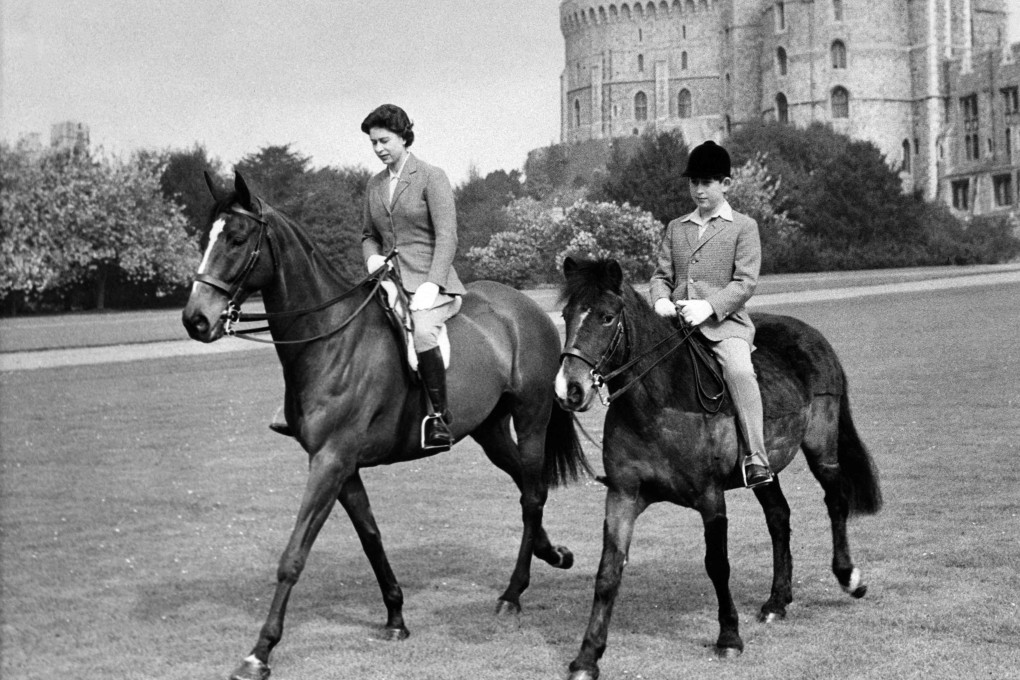 Queen Elizabeth II loved horses and riding. Here she is with a young Prince Charles. Photo: AFP