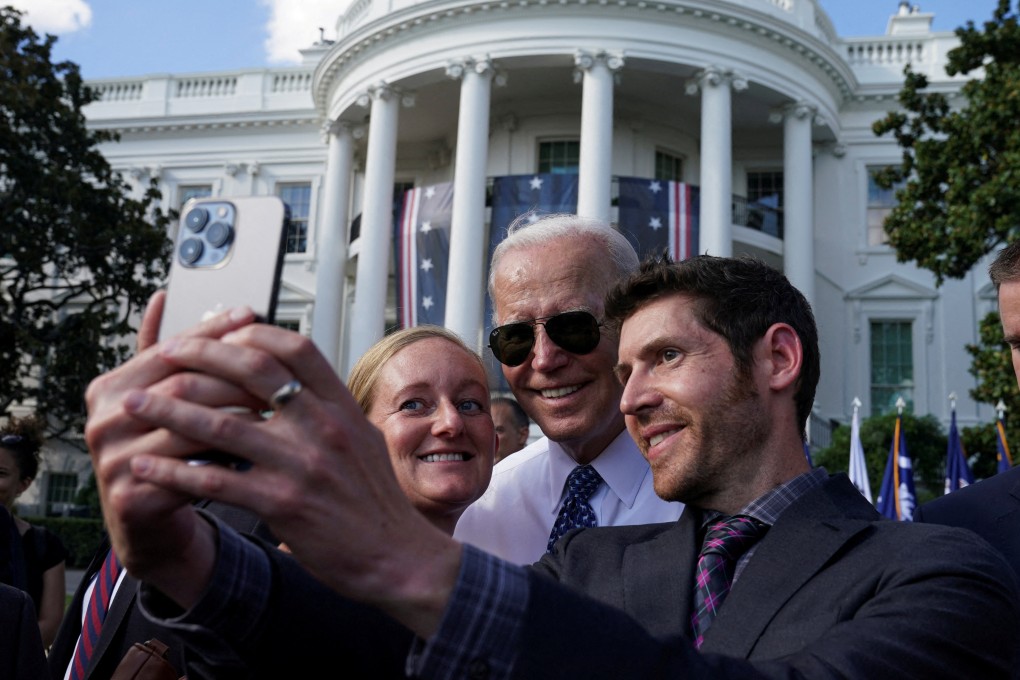 US President Joe Biden posing for a selfie with guests at the White House on September 13. Photo: Reuters
