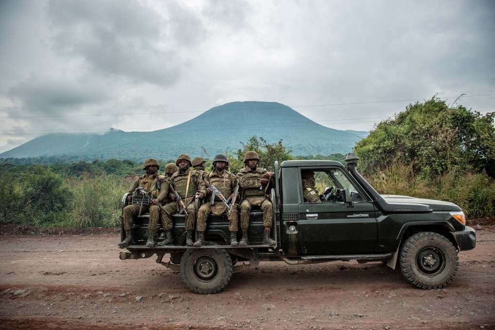 A Congolese army truck carries troops towards the front line in clashes with rebels near the city of Goma on May 25. As Russian arms supplies face sanctions, and Western security operations fade, China is moving to expand military ties with African nations. Photo: AFP