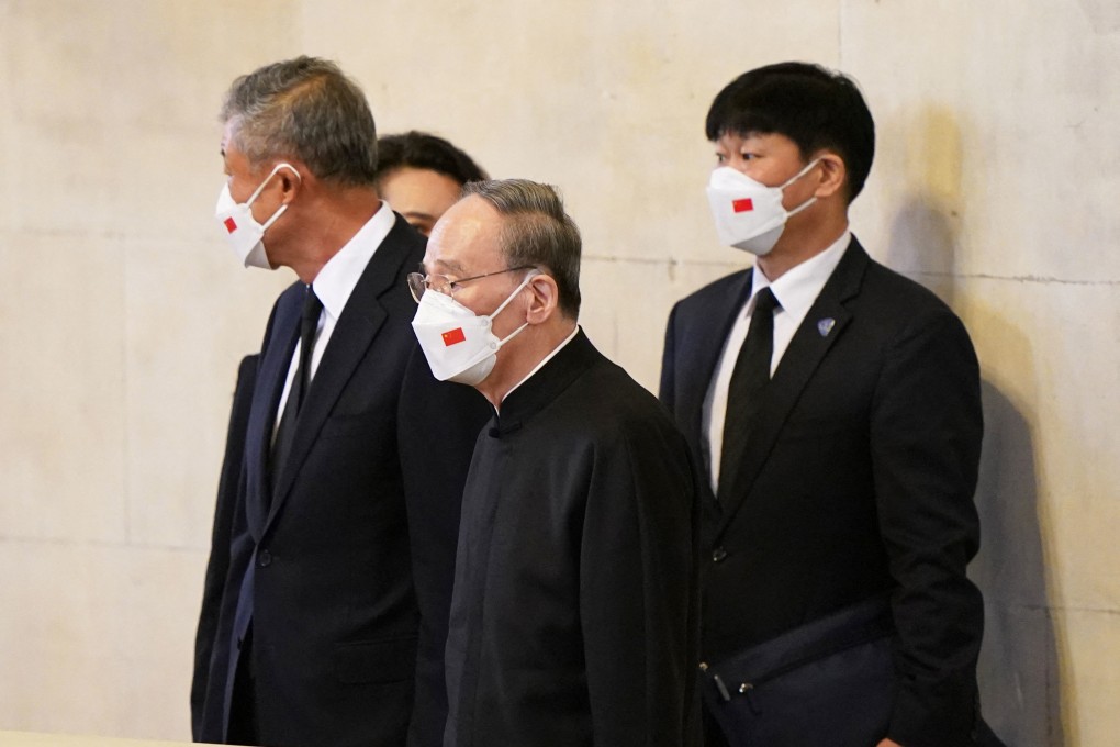 Chinese Vice President Wang Qishan and other members of a Chinese delegation view the coffin of Queen Elizabeth lying in state at Westminster Hall on Sunday. Photo: Reuters