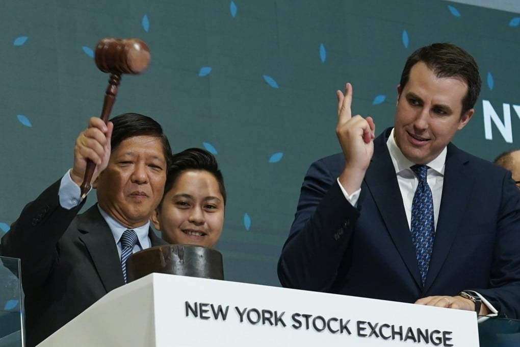 Philippine President Ferdinand Marcos Jnr with a gavel, poised to ring the bell at the New York Stock Exchange on Monday. Photo: AP