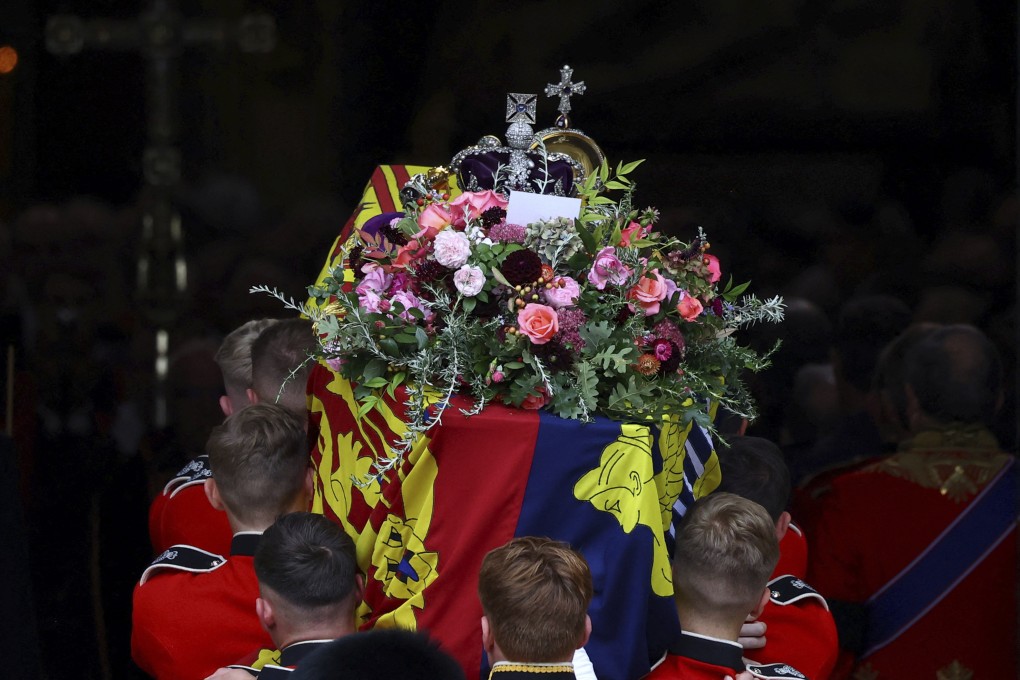 The coffin of Britain’s Queen Elizabeth is carried into the Westminster Abbey, during her funeral in London on September 19. The list of absentees from Monday’s funeral revealed the deep divisions roiling global geopolitics. Photo: AP