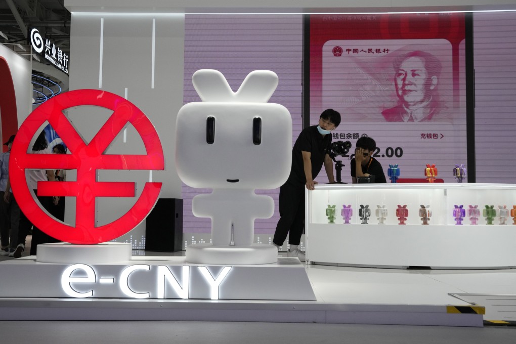 Representatives staff a booth promoting the e-CNY, China’s digital currency, during the China International Fair for Trade in Services (CIFTIS) in Beijing on September 2, 2022. Photo: AP