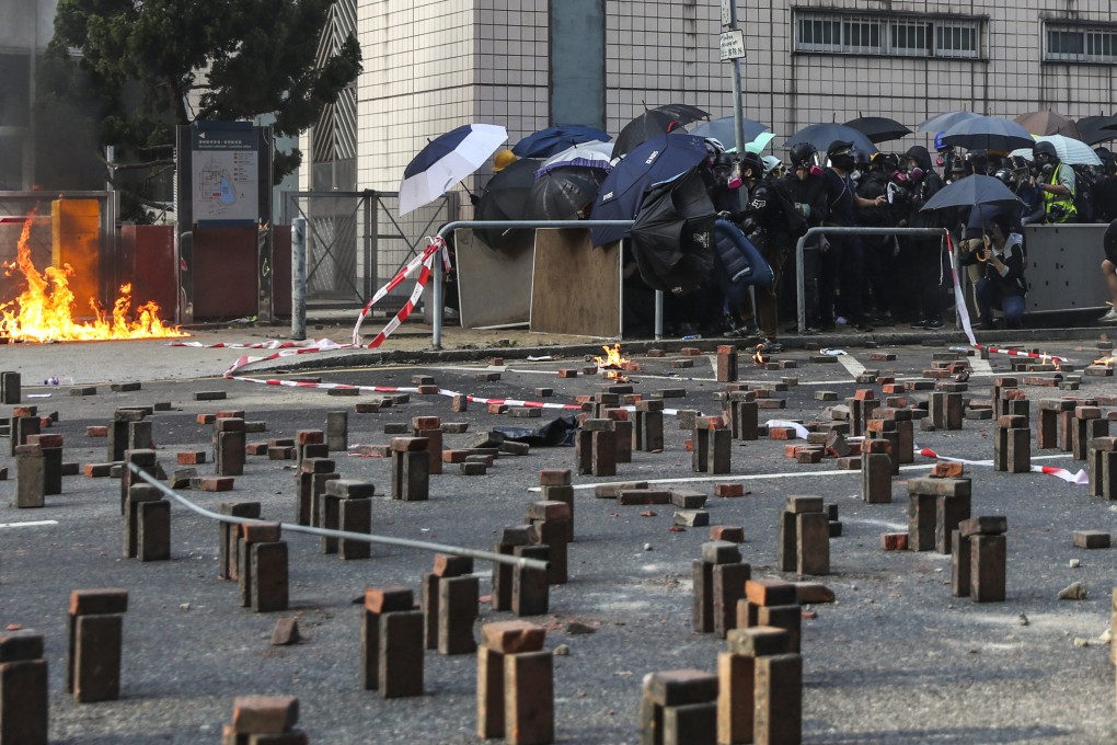 Clashes break out for a second day between riot police and anti-government protesters at Polytechnic University in Hung Hom on November 18, 2019. Photo: Sam Tsang