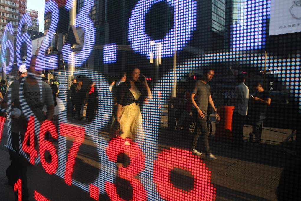 An electric board shows the Hang Seng Index outside an HSBC branch in Mong Kok, Hong Kong. Photo: Sam Tsang