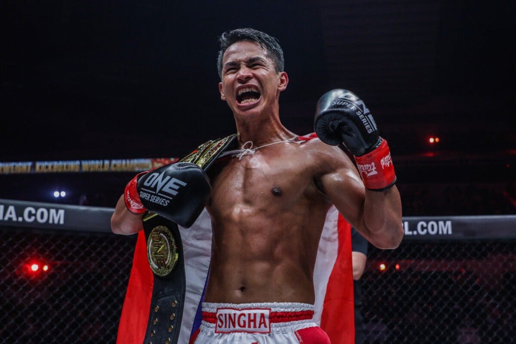 Featherweight kickboxing champion Superbon celebrates a successful title defense against Marat Grigorian. Photos: ONE Championship.