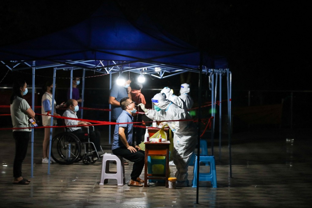 Medical workers collect swabs from residents at a nucleic acid testing site following a Covid-19 outbreak in Guiyang, Guizhou province, September 9. Photo: Reuters