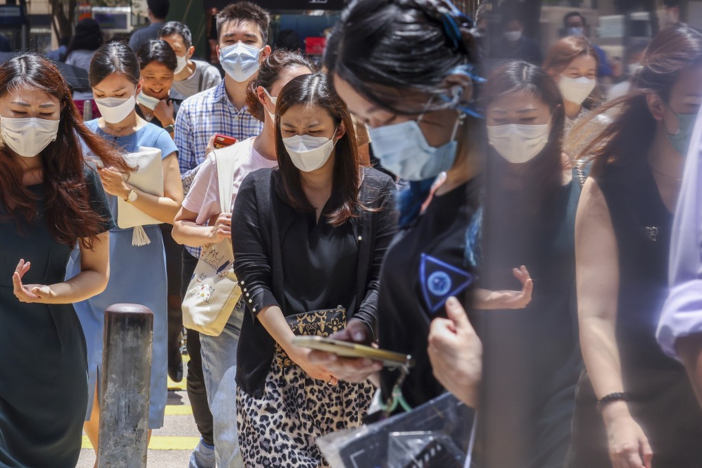 Hongkongers masked up in Central. The city has weathered the worst of a fifth Covid-19 wave. Photo: Nora Tam