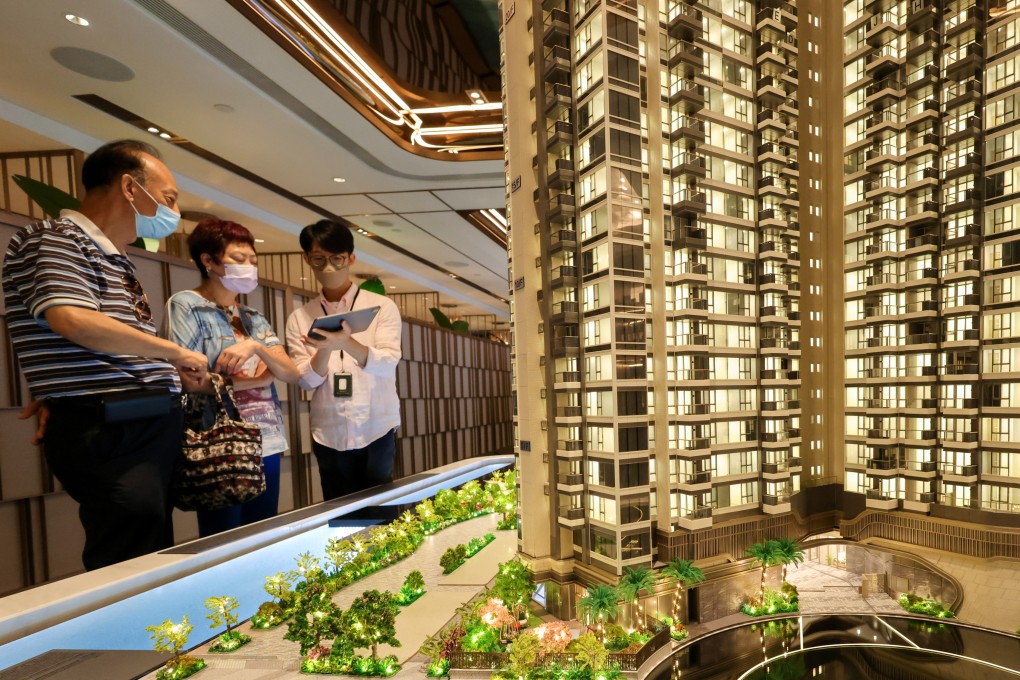 Potential buyers look at the model of a residential project in Hong Kong. Photo: Dickson Lee
