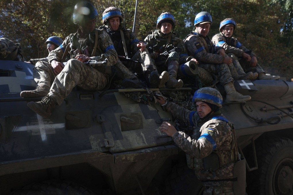 Ukrainian soldiers have a break on their way to the frontline against Russian troops in the Donetsk region on September 21. Photo: AFP