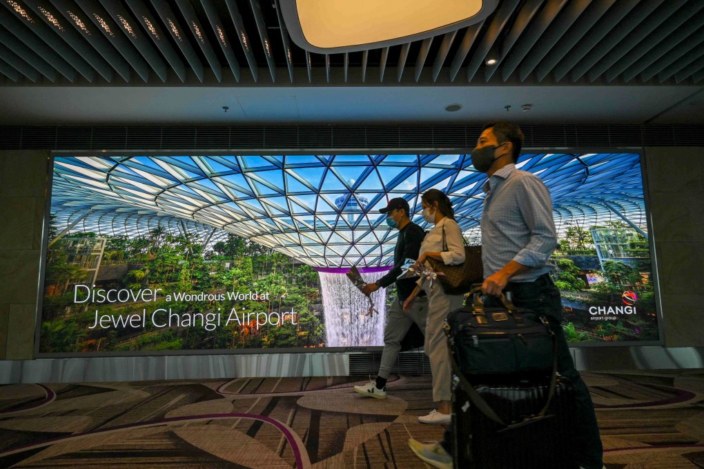Passengers arrive at the reopened Changi International Airport Terminal 4 in Singapore on September 13, following a closure for more than two years due to the Covid-19 coronavirus pandemic. Photo: AFP