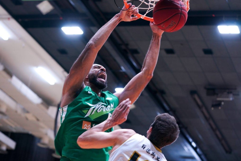 Tycoon centre Michael Holyfield scores 32 points against Shung Tak Alumni Eagle to help them win the first ever regular season A1 Division title. Photo: Hangout