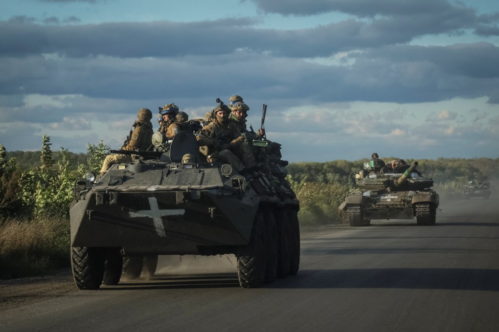 Ukrainian servicemen ride on Armoured Personnel Carrier (APC) and a tank as Russia’s attack on Ukraine continues. Photo: Reuters