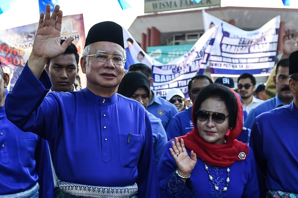 Malaysia’s then-Prime Minister Najib Razak and his wife Rosmah Mansor wave to supporters in 2018. Photo: AFP